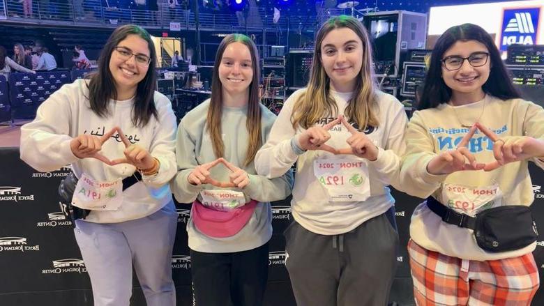 Berks dancers hold up diamonds in recognition of THON